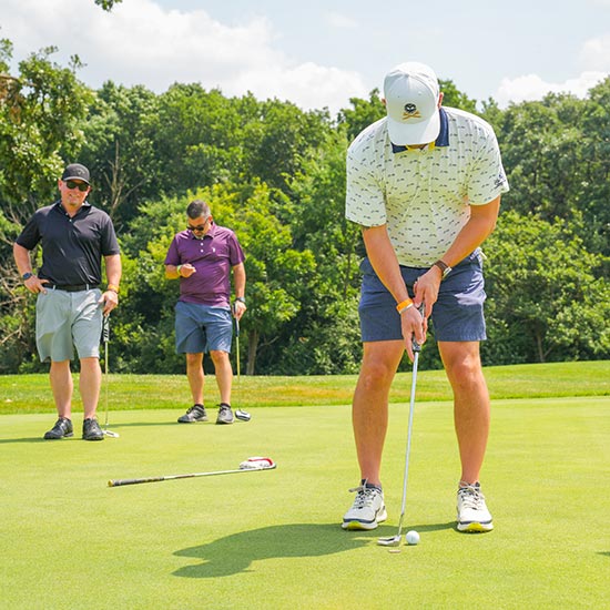 People golfing