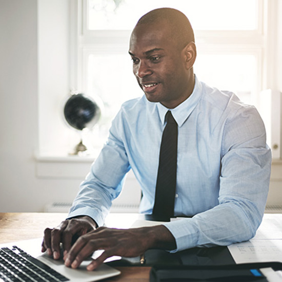 man typing on a computer